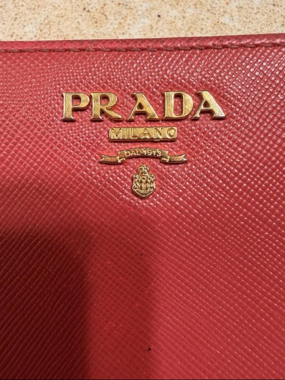 Prada Red Saffiano Zip-Around Wallet with Gold Logo